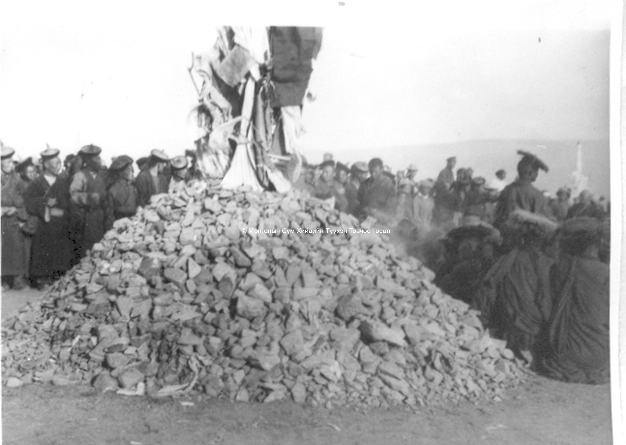 Monks near an ovoo (Tasganii ovoo?). Film Archives K-24783